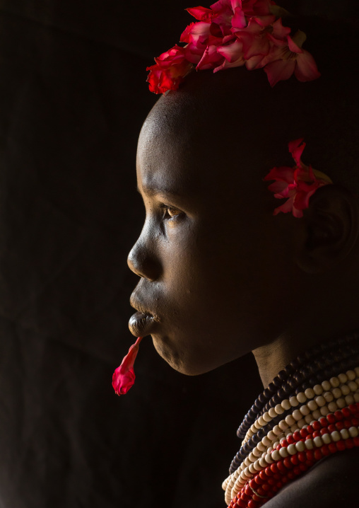 Karo tribe child with flowers decorations, Omo valley, Korcho, Ethiopia