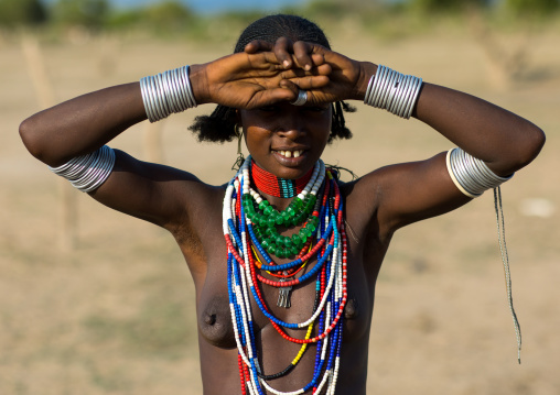 Portrait of an Erbore tribe woman protecting from the sun, Omo valley, Murale, Ethiopia