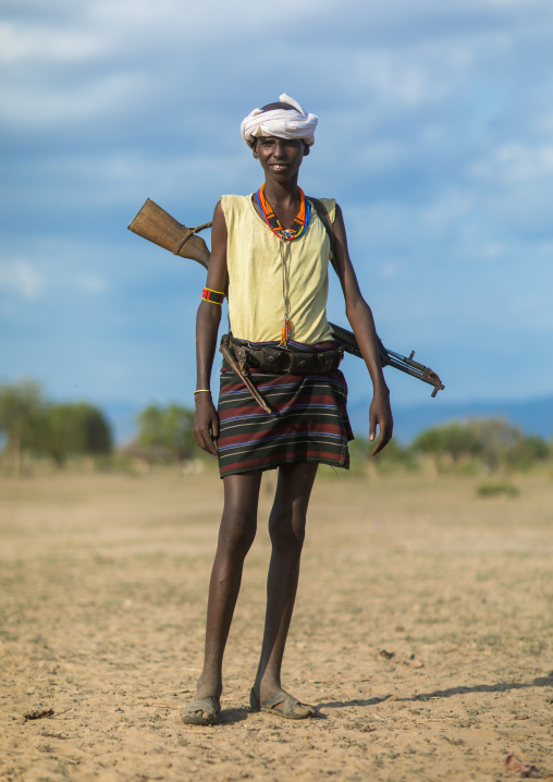 Erbore tribe warrior with a kalashnikov, Omo valley, Murale, Ethiopia