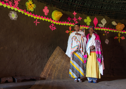 Portrait of Gurage women inside their traditional house decorated with doilies on the walls, Gurage Zone, Butajira, Ethiopia