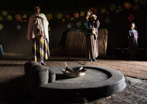 Gurage family inside their traditional house decorated with doilies on the walls, Gurage Zone, Butajira, Ethiopia