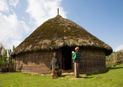 People in front of a Gurage traditional house with thatched roof, Gurage Zone, Butajira, Ethiopia
