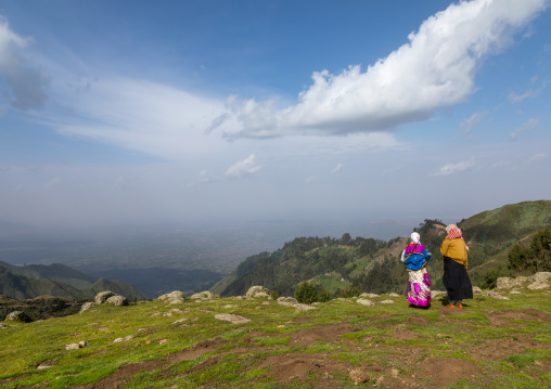 Two Gurage tribe women on a hill looking the valley, Gurage Zone, Butajira, Ethiopia