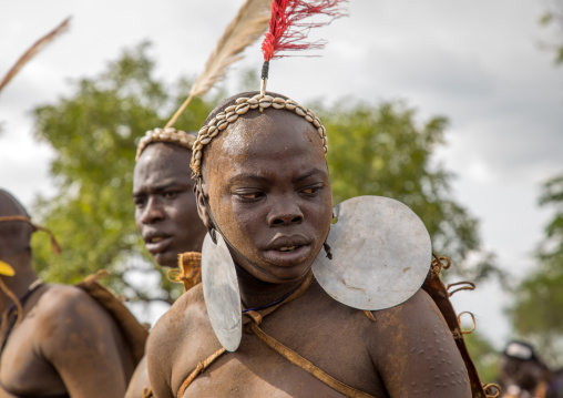 Bodi tribe fat man with giant earrings during Kael ceremony, Omo valley, Hana Mursi, Ethiopia