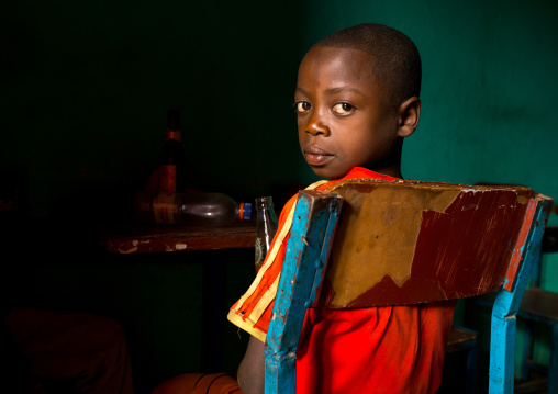 Ethiopian boy sit in a bar, Omo valley, Jinka, Ethiopia