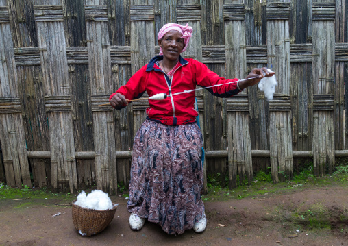 Dorze woman spinning cotton, Gamo Gofa Zone, Gamole, Ethiopia