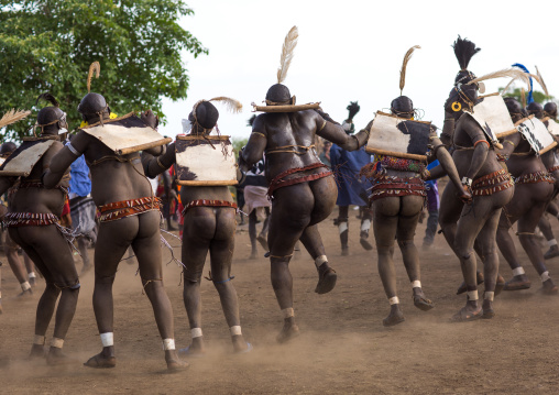 Bodi tribe fat men dancing during Kael ceremony, Omo valley, Hana Mursi, Ethiopia