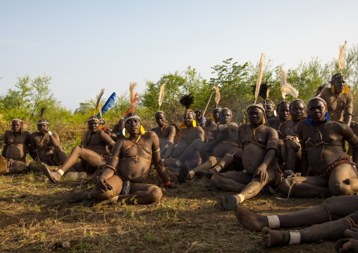 Bodi tribe fat men resting during Kael ceremony, Omo valley, Hana Mursi, Ethiopia