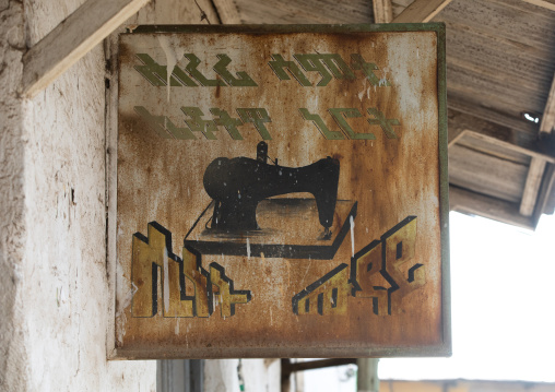 Old taylor sign above a shop, Harari Region, Harar, Ethiopia