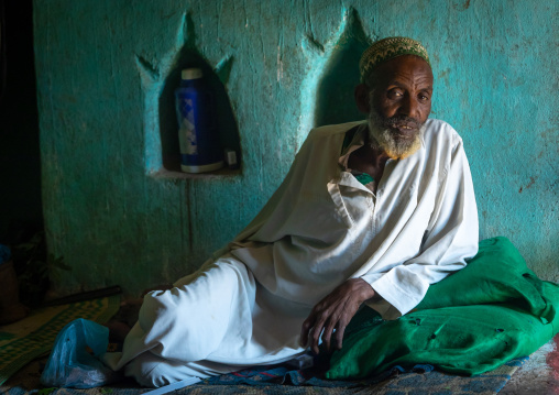 Harari man chewing khat inside an old house, Harari Region, Harar, Ethiopia