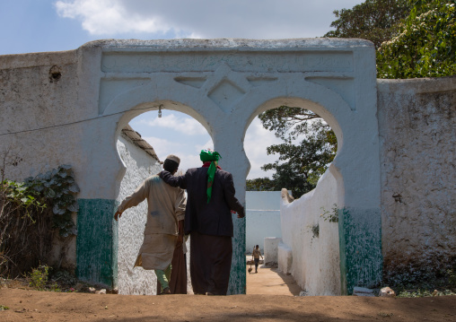 Men at the entry of a muslim holy site, Harari Region, Harar, Ethiopia