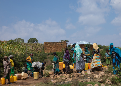 Ethiopian people pumping water in a well, Harari Region, Harar, Ethiopia