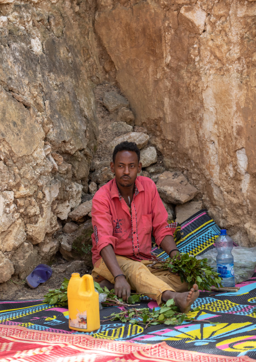 Harari man chewing khat during a sufi celebration, Harari Region, Harar, Ethiopia