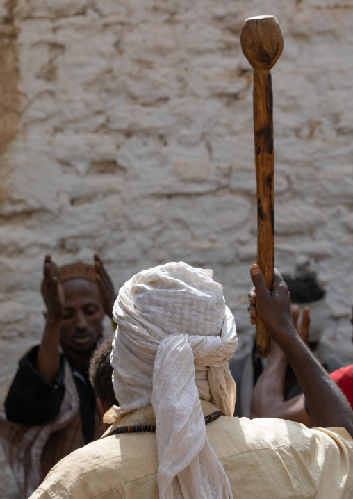 Harari man during a sufi celebration dancing with a stick, Harari Region, Harar, Ethiopia