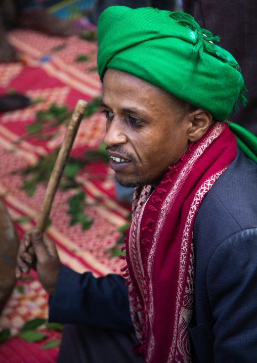 Harari islamic cleric beating drum during a sufi celebration, Harari Region, Harar, Ethiopia