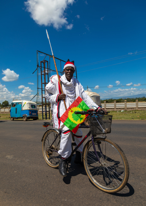Ethiopian man on a bicycle during a oromo liberation front party rally, Oromia, Waliso, Ethiopia