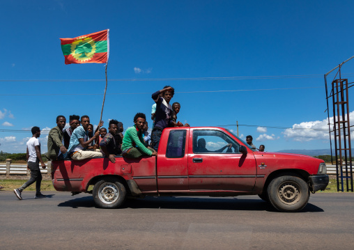 Men in a car celebrating the oromo liberation front party, Oromia, Waliso, Ethiopia