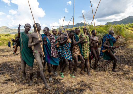 Group of suri tribe warriors during a donga stick fighting ritual, Omo valley, Kibish, Ethiopia