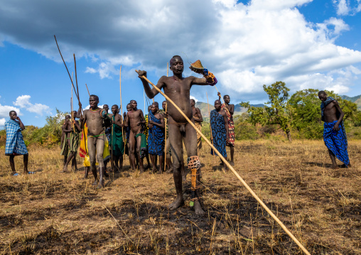 Suri tribe warriors parading before a donga stick fighting ritual, Omo valley, Kibish, Ethiopia