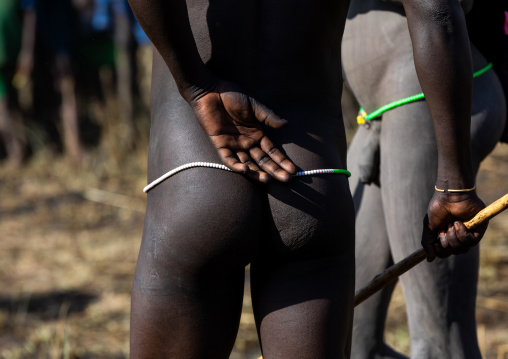 Naked suri tribe warriors during a donga stick fighting ritual, Omo valley, Kibish, Ethiopia