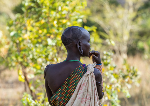Rear view of a suri tribe woman, Omo valley, Kibish, Ethiopia