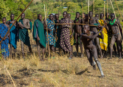 Suri tribe warriors fighting during a donga stick ritual, Omo valley, Kibish, Ethiopia