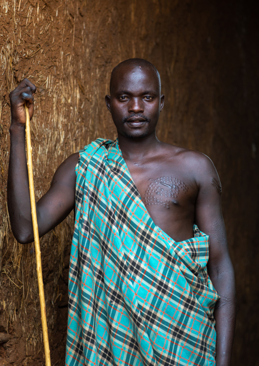 Portrait of a suri tribe man with a stick, Omo valley, Kibish, Ethiopia