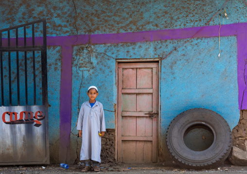 Muslim boy in front of a house, Bench Maji, Dima, Ethiopia