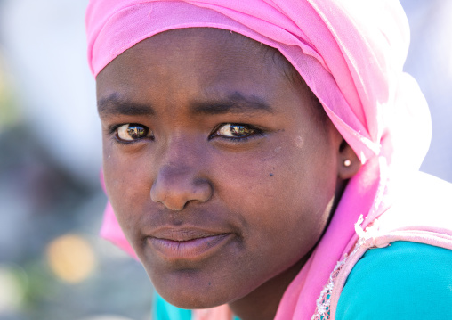 Oromo teenage girl with a pink headscarf, Amhara region, Senbete, Ethiopia