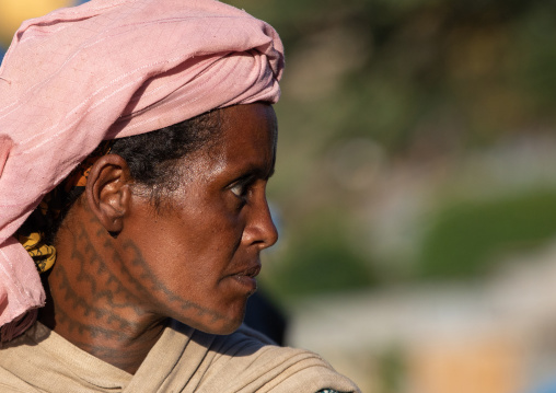 Ethiopian woman with tatoo on her face and neck, Amhara region, Senbete, Ethiopia