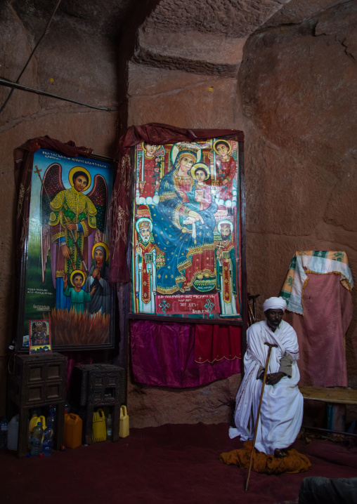 Orthodox priest inside bete gabriel rafael twin church, Amhara Region, Lalibela, Ethiopia