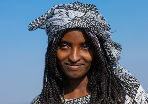 Portrait of a smiling afar woman, Afar region, Mile, Ethiopia