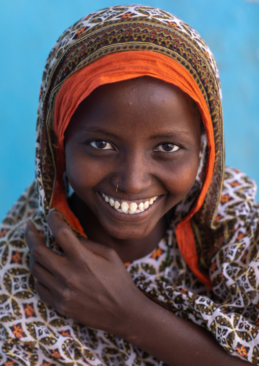 Portrait of a veiled smiling afar tribe girl with sharpened teeth, Afar Region, Afambo, Ethiopia