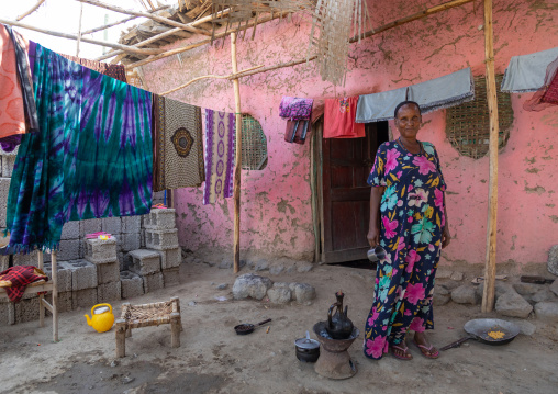 Ethiopian woman inside her house courtyrad, Afar Region, Assayta, Ethiopia