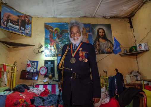 Veteran from the italo-ethiopian war in army uniform inside his home, Addis Abeba region, Addis Ababa, Ethiopia