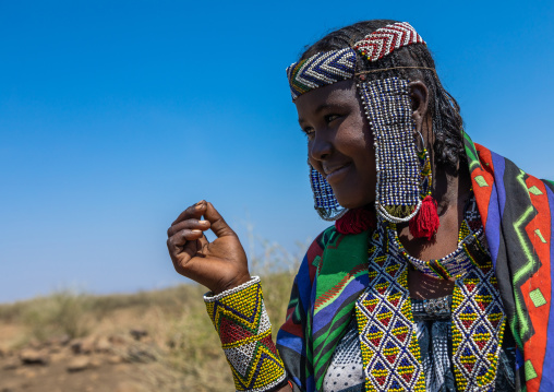 Portrait of an issa tribe woman with a beaded headwear, Afar Region, Gewane, Ethiopia