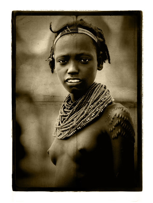 Sepia Portrait Of A Dassanech Tribe Girl With Traditional Necklaces, Omorate, Omo Valley, Ethiopia