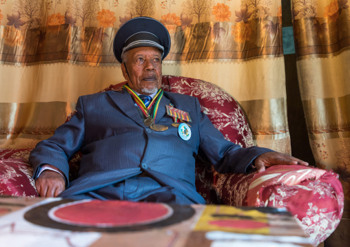 Ethiopian veteran from the italo-ethiopian war in army uniform in his home, Addis Ababa Region, Addis Ababa, Ethiopia