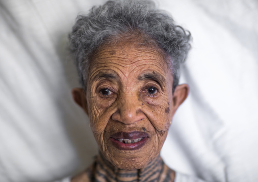 Ethiopian veteran woman from the italo-ethiopian war with tattoes in the neck, Addis Ababa Region, Addis Ababa, Ethiopia
