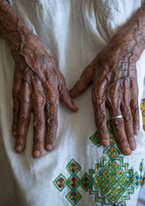 Ethiopian old woman with tattooes on her hands, Addis Ababa Region, Addis Ababa, Ethiopia