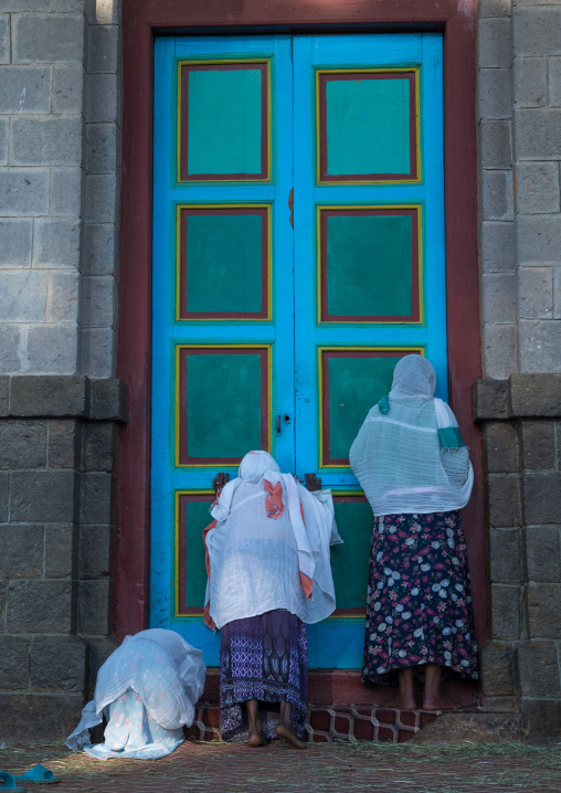 Ethiopian orthodox women praying in front of Entoto orthodox Maryam Church, Addis Ababa Region, Addis Ababa, Ethiopia