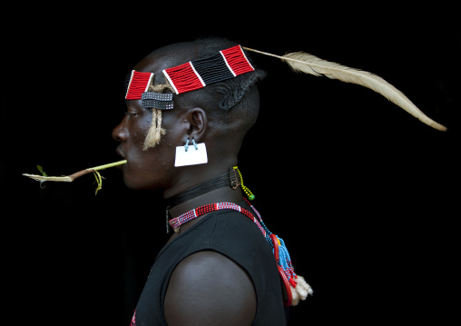Bana Tribe Man Wearing A Headband With Feather, Strass Clips And Sim Card As Earring, Key Afer, Omo Valley, Ethiopia