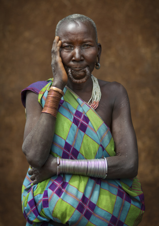 Suri tribe woman with a stretched lip, Kibish, Omo valley, Ethiopia