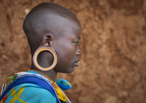 Suri tribe girl with enlarged earlobe, Kibish, Omo valley, Ethiopia