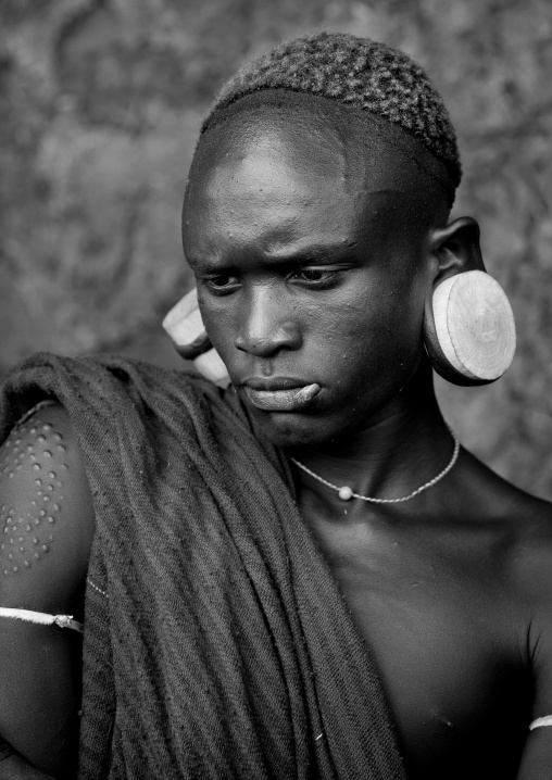 Suri tribe man with enlarged earlobes, Kibish, Omo valley, Ethiopia