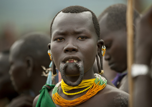 Suri tribe woman with enlarged lip at a ceremony, Kibish, Omo valley, Ethiopia