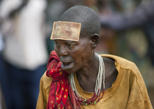 Old Suri tribe woman with a bill on her forehead at a ceremony, Kibish, Omo valley, Ethiopia