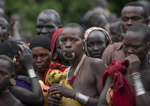 Suri tribe women at a ceremony with enlarged earlobes and lip, Kibish, Omo valley, Ethiopia