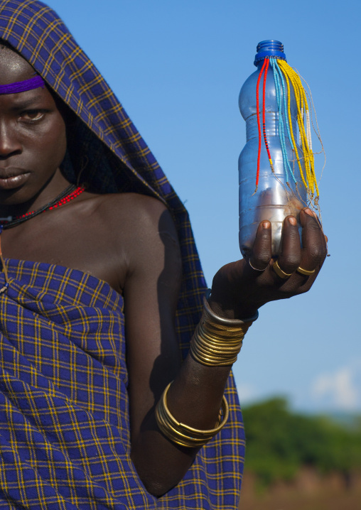 Bodi Tribe Girl Holding A Bottle Decorated With Beads, Hana Mursi, Omo Valley, Ethiopia
