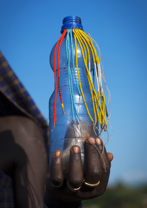 Close Up Of A  A Bottle Decorated With Beads, Hana Mursi, Omo Valley, Ethiopia